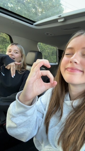 Reagan and friend taking car selfie