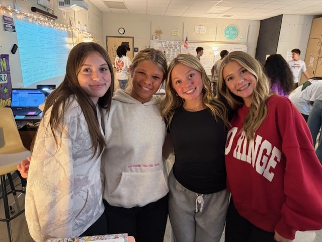 Reagan with friends in classroom