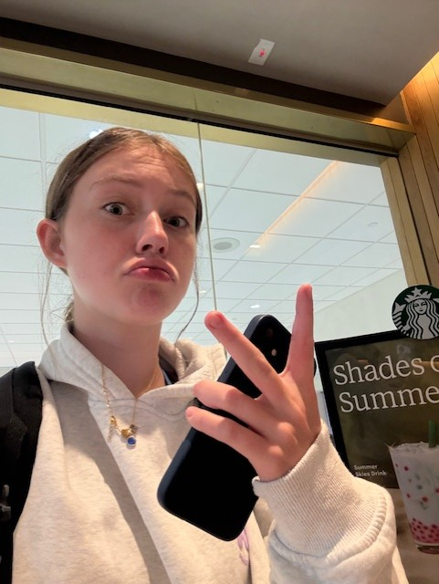 Reagan taking mirror selfie at Starbucks